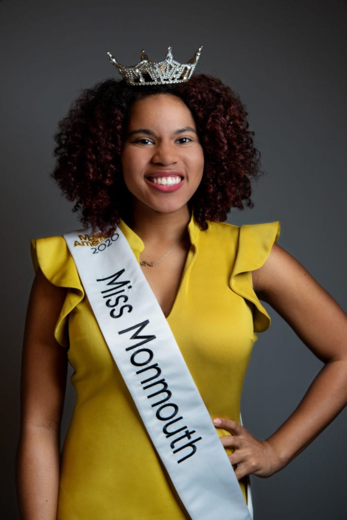 A headshot picture of an African American woman wearing a Miss Monmonth sash.