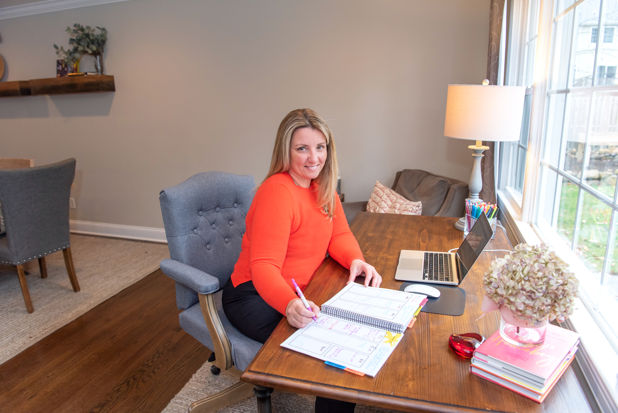 A female social media marketer working in her home office.