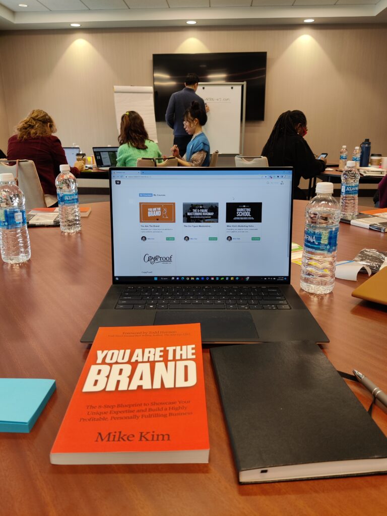 Mike Kim's You Are The Brand Workshop in Fort Lee, New Jersey with his book and notebook for the attendees.