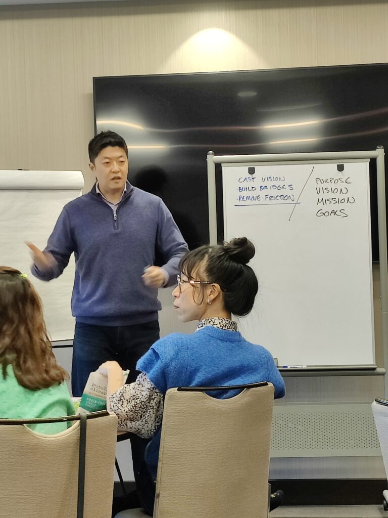 Mike Kim, author, brand strategist and copywriter, teaching his You Are The Brand Workshop in Fort Lee, New Jersey.