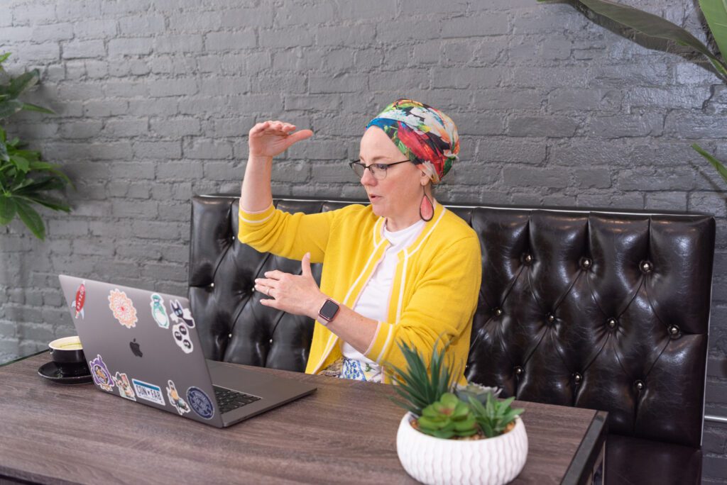 A female digital marketer on a video conference at Iconic Coffee in downtown Hackensack, New Jersey.