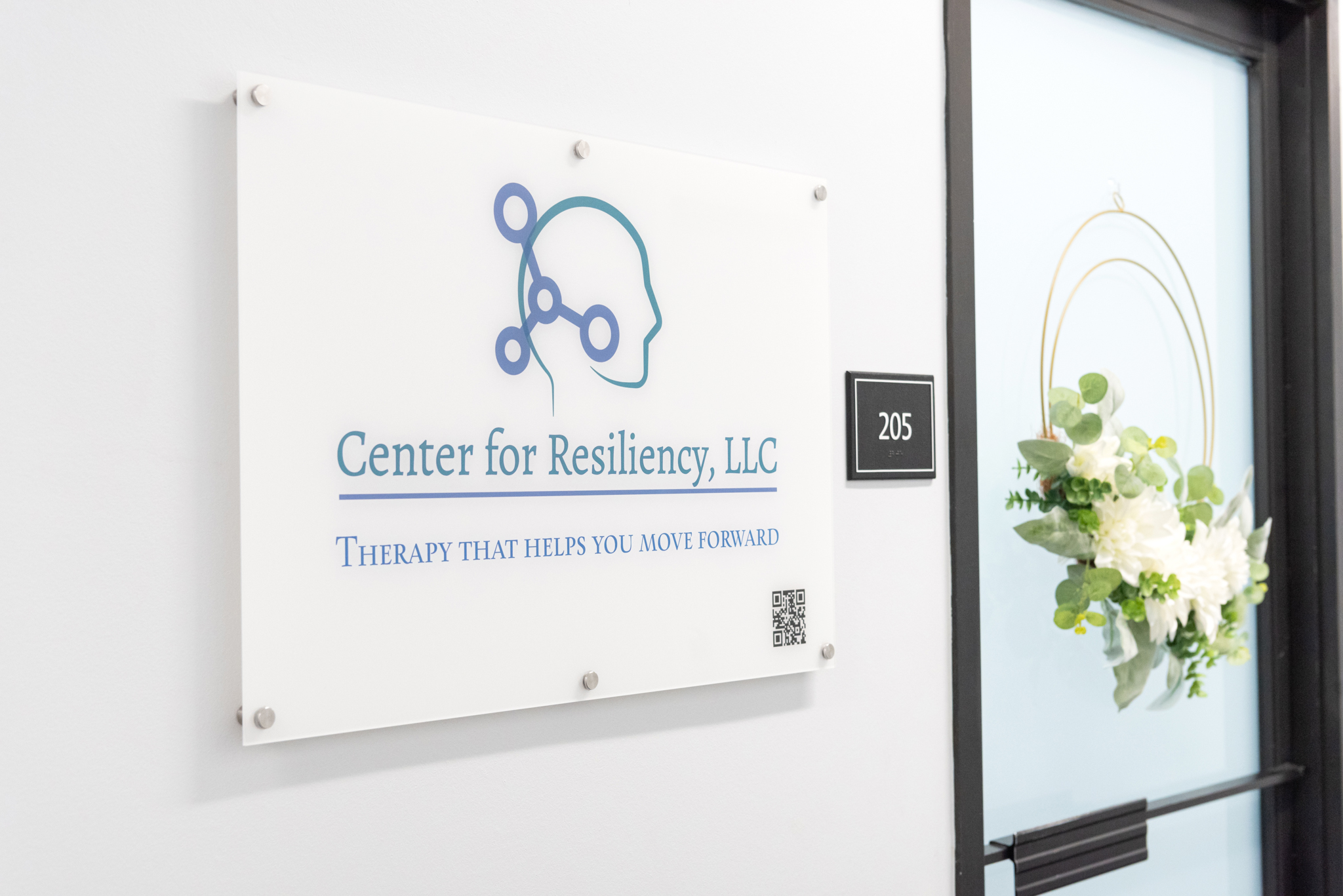 A sign to a female psychologist office - "Center for Resiliency"