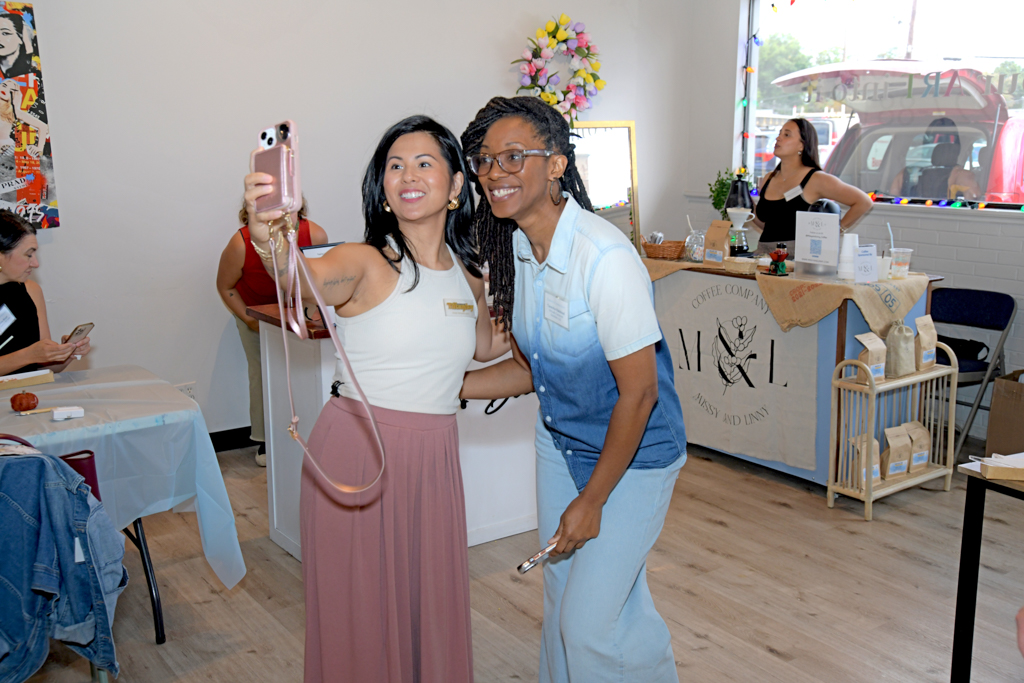 Two attendees are taking a selfie at the Canvas & Connections: Celebrating Women Business Owners event at Moda Studio in Fairfield, NJ.