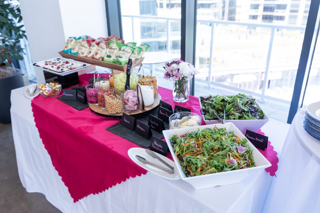 Salas, chips, and dessert table at the Wave Resort event space in Long Branch.