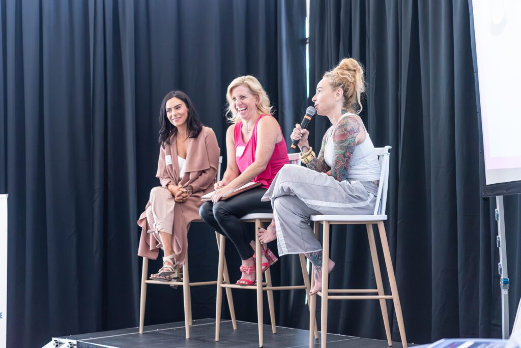 Three female panelist on the stage at the Your Strategy Reset event in the Wave Resort.