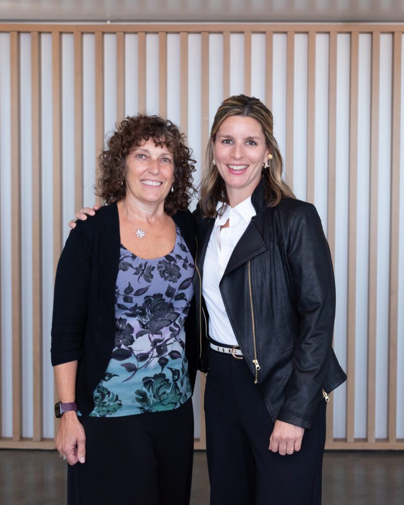 Two females pose for a photo at the Your Strategy Reset event in the Wave Resort.