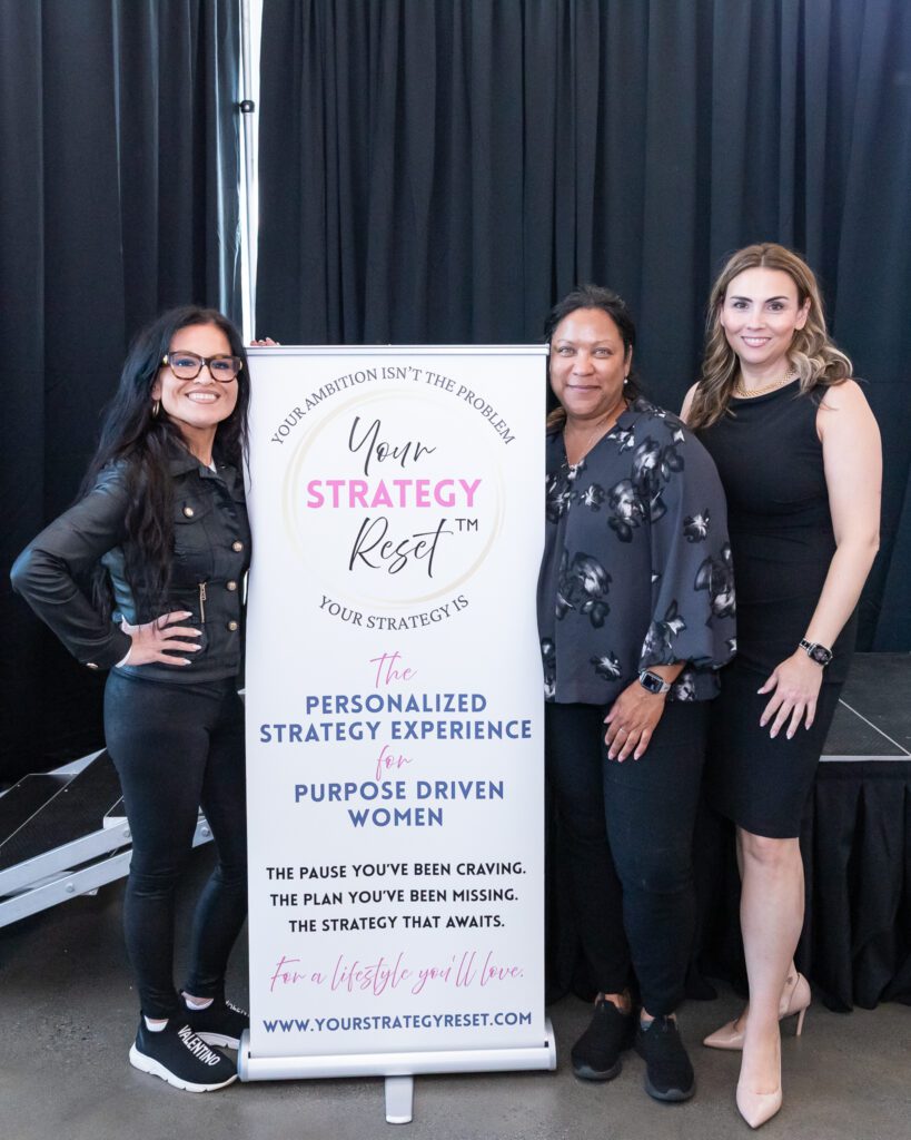 Three females pose for a photo at the Your Strategy Reset event in the Wave Resort.