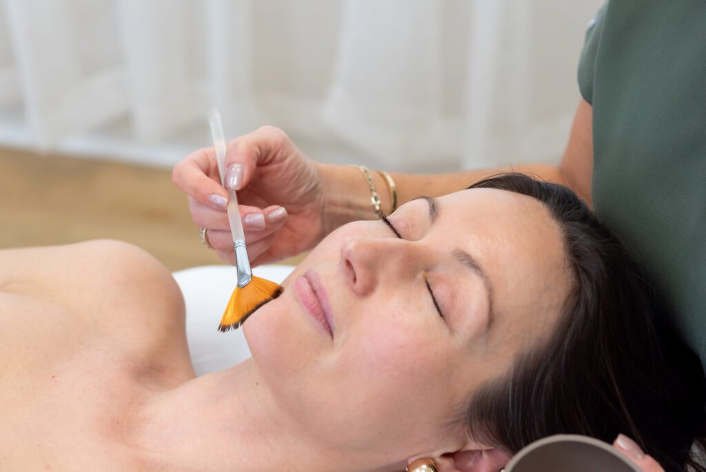 A female getting a facial treatment.